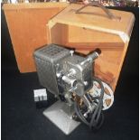 A VINTAGE 'KODASCOPE 8' PROJECTOR in original fitted wooden box, with leather carry handle