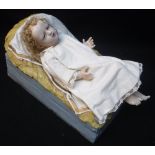 A 19TH CENTURY CONTINENTAL WAX HEADED 'JESUS' DOLL/CRIB FIGURE, with wax limbs and filled material