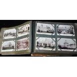 A LARGE EARLY 20TH CENTURY POSTCARD ALBUM (dated 1908) containing many postcards including