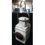 A VINTAGE 'B.R.' RAILWAY LAMP IN CREAM with red lenses, burner intact Condition: in original