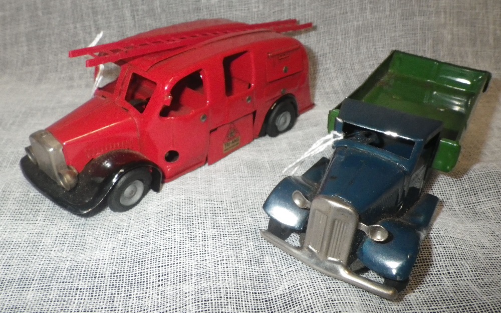 MINIC TOYS: A TIN-PLATE FLAT BED TRUCK, with dark blue cab and green lift and a tin-plate fire