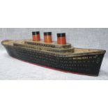 A 1930S FRENCH 'GESSLOT ET VOREUX' BISCUIT TIN IN THE FORM OF THE OCEAN LINER 'SS NORMANDIE' made by