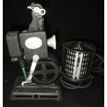 A VINTAGE 'PATHESCOPE KID' HAND CRANKED PROJECTOR Condition: appears in good condition and winds¦not