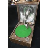 A VINTAGE 'DECCA JUNIOR' PICNIC GRAMOPHONE in a leather effect case Condition: it is running¦appears