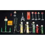 A COLLECTION OF CAST METAL PETROL PUMPS, signs and street furniture, some by Dinky Condition: all