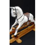 A CHILD'S ROCKING HORSE with safety pine frame, restored with new leather saddle and tack 43.5" high