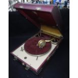 A VINTAGE 1930S 'DECCA 20' PORTABLE GRAMOPHONE in a red case Condition: looks to be in good original