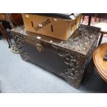 A CAMPHORWOOD TRUNK with carved decoration