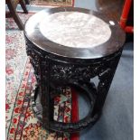 A CHINESE HARDWOOD CIRCULAR DISPLAY STAND with inset rouge marble top, 13.5" dia