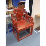 A TRADITIONAL CHINESE ARMCHAIR with red lacquered and painted decoration