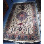 A CREAM GROUND WILTON RUG of Persian design 88" long (plus fringes) x 54" wide