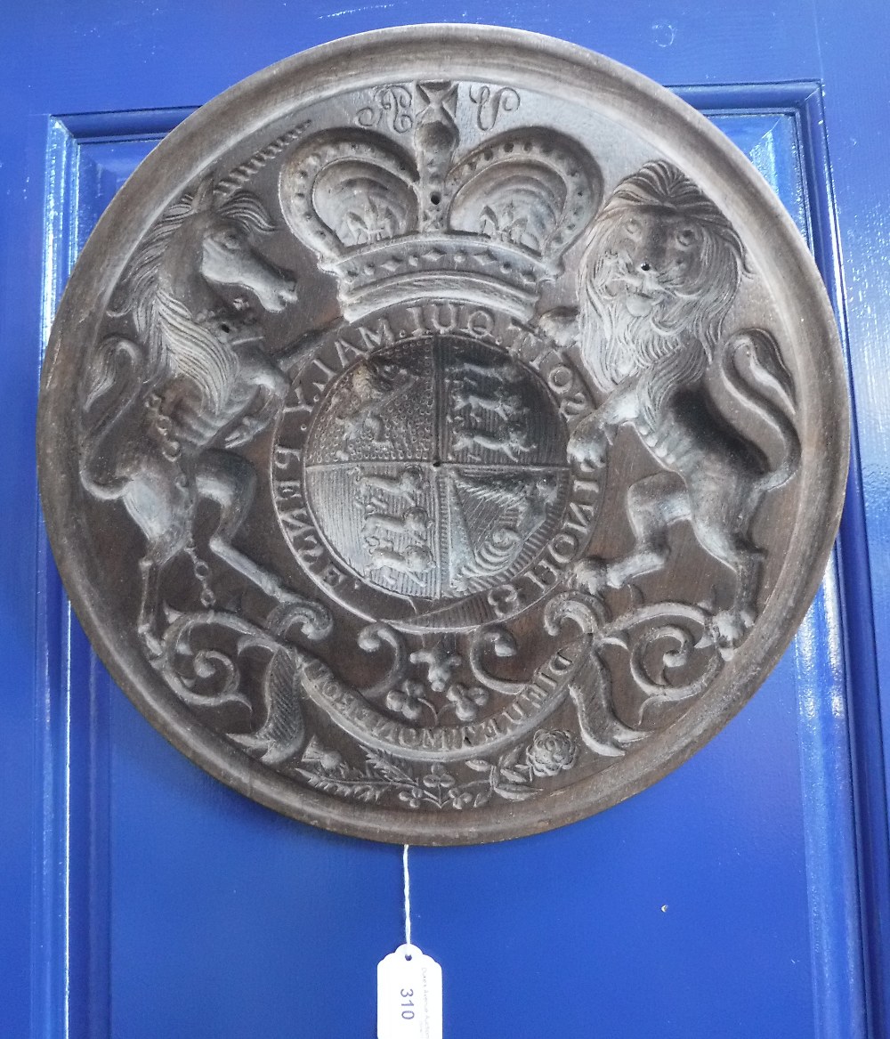 A VICTORIAN CIRCULAR CARVED BUTTER OR SIMILAR MOULD in the form of a Victorian Coat-of-Arms