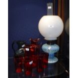 A VICTORIAN CRANBERRY GLASS JUG and four beakers, a similar jug, a green glass jug and a Victorian
