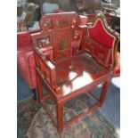 A TRADITIONAL CHINESE ARMCHAIR with red lacquered and painted decoration