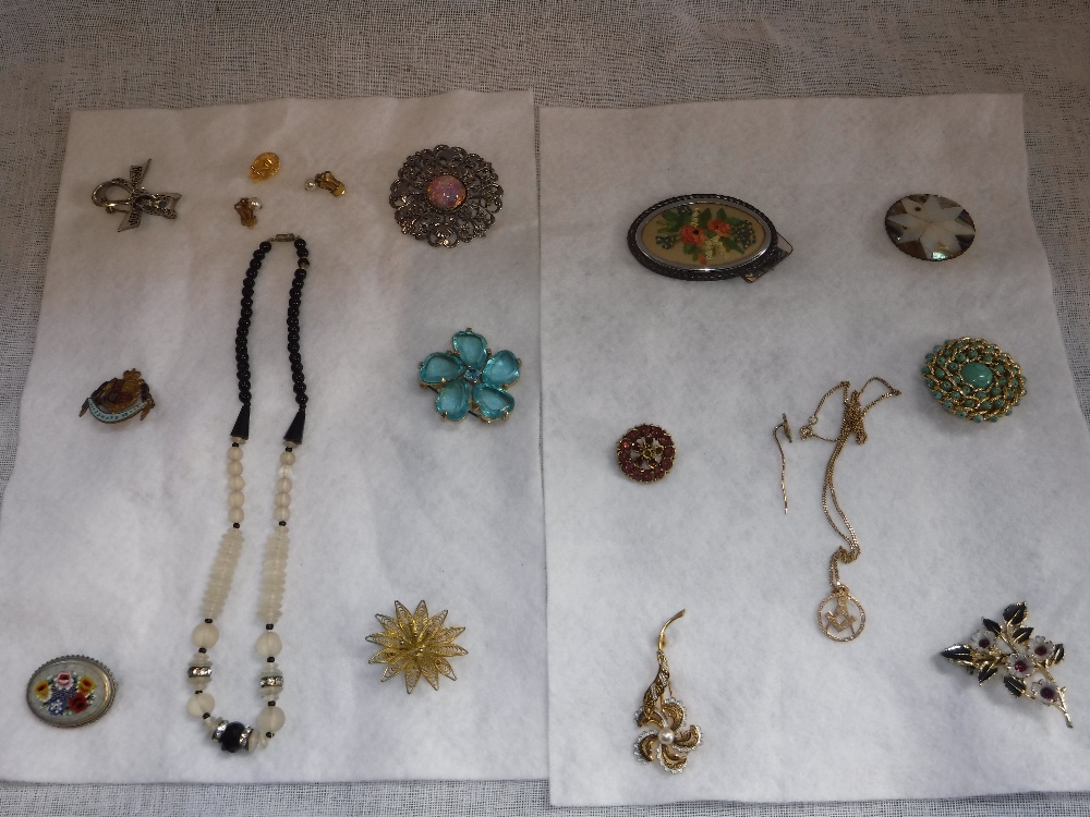 A LARGE COLLECTION OF COSTUME JEWELLERY BROOCHES including some set with mother-of-pearl and a