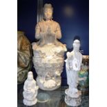 A CHINESE DEHUA (BLANC DE CHINE) GUANYIN WITH CHILD, 18th/19th century and two other figures