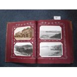 A POSTCARD ALBUM containing a large quantity of postcards including The Pier, Bournemouth,