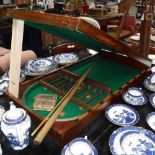 A LATE 19TH CENTURY MAHOGANY BILLIARDS GAME, in a mahogany case, with cues and billiard balls