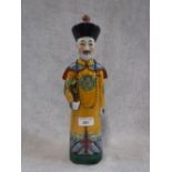 A CHINESE EXPORT PORCELAIN MODEL OF A COURTIER, REPUBLIC PERIOD