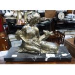 AN ART DECO GILT SPELTER STUDY of a young woman with a deer, on a marble base