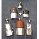 A SMALL COLLECTION OF HIP-FLASKS including a leather mounted flask