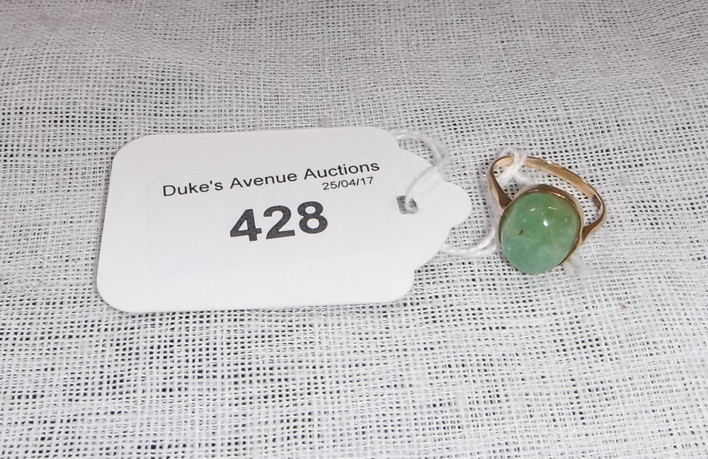 A CABOCHON GREEN STONE RING set in 9ct gold, possibly Beryl