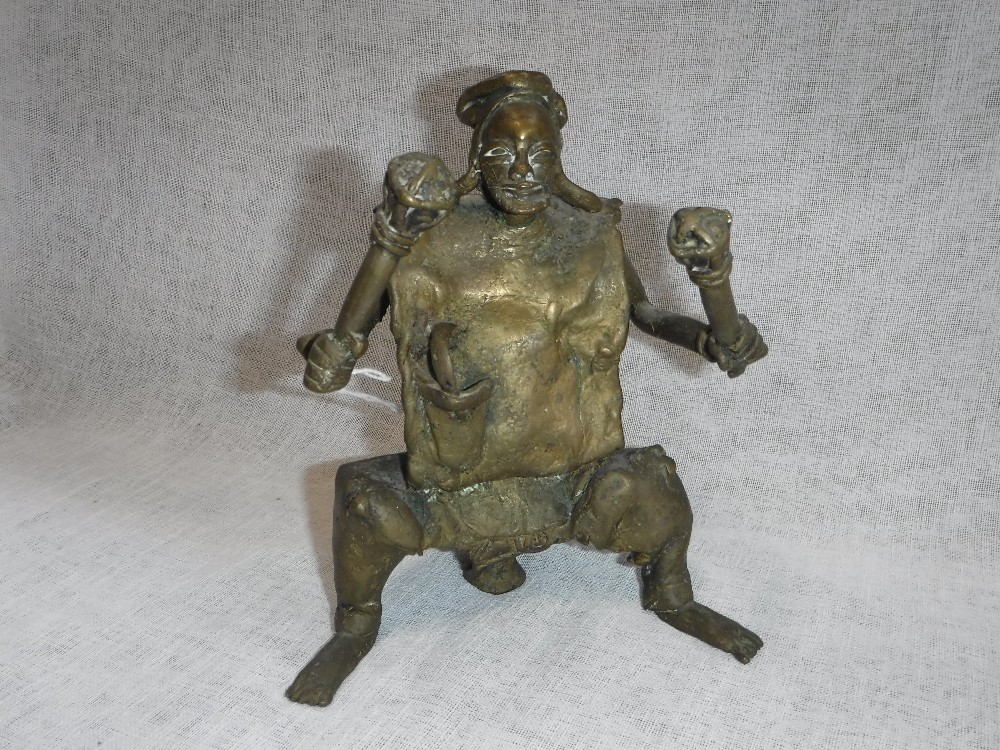 AN AFRICAN STYLE BRONZE of a man holding two clubs, possibly from the 'Bamiceice Tribe'