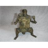 AN AFRICAN STYLE BRONZE of a man holding two clubs, possibly from the 'Bamiceice Tribe'
