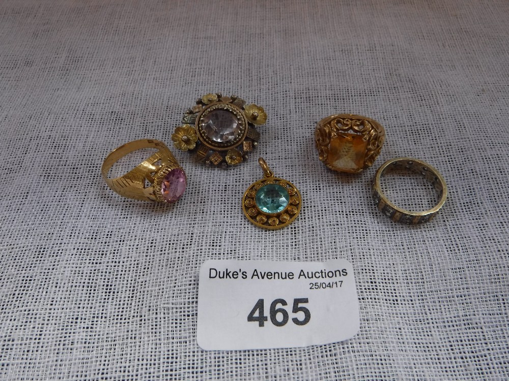 AN UNMARKED YELLOW METAL AND BLUE STONE WIREWORK PENDANT, a citrine ring and a collection of other