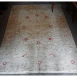 A CREAM GROUND PERSIAN DESIGN RUG with pale red stylised floral design 93" long (plus fringes) x 67"