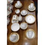 A COLLECTION OF 19TH CENTURY WHITE AND GILT BANDED TEAWARE, including a handled sucrier