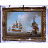 A REPRODUCTION OIL ON MAHOGANY MARITIME SCENE with battleships in a gilt frame