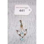 AN EDWARDIAN 9CT YELLOW GOLD OPENWORK PENDANT, set with two blue stones