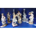 A COLLECTION OF CERAMIC FIGURES including a woman playing a triangle and others