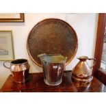 A COPPER BUCKET made by Barthes-Roberts Ltd, London and two copper measurers and a large Persian