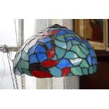 A TIFFANY STYLE COLOURED GLASS LAMPSHADE with floral design