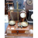 A SET OF MAHOGANY AND BRASS CHEMIST'S SCALES
