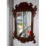 A GEORGE III WALNUT FRAMED WALL MIRROR and another similar