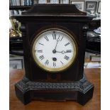 A VICTORIAN MANTEL CLOCK in an ebonised and walnut case (pendulum in office)