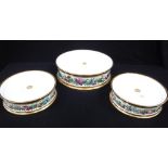 A THREE TIER CERAMIC CAKE STAND with gilt and floral decoration