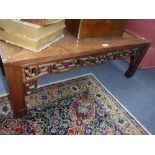 A CHINESE HARDWOOD LOW TABLE, with central burrwood panel, 39.5" wide x 18" deep