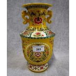 A CHINESE VASE with polychrome decoration against a yellow ground with gilt mark
