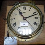 A BRASS CASED SHIP'S CLOCK