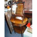 AN EDWARDIAN MAHOGANY OVAL WINDOW TABLE and two dressing mirrors