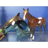 A POOLE POTTERY DOLPHIN and a Beswick horse