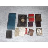 A COLLECTION OF MINIATURE BOOKS and vesta cases and other items in the form of miniature books