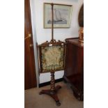 A REGENCY ROSEWOOD POLE SCREEN with a needlework floral panel 56" high