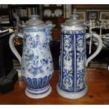 TWO GERMAN STONEWARE STEINS with pewter lids