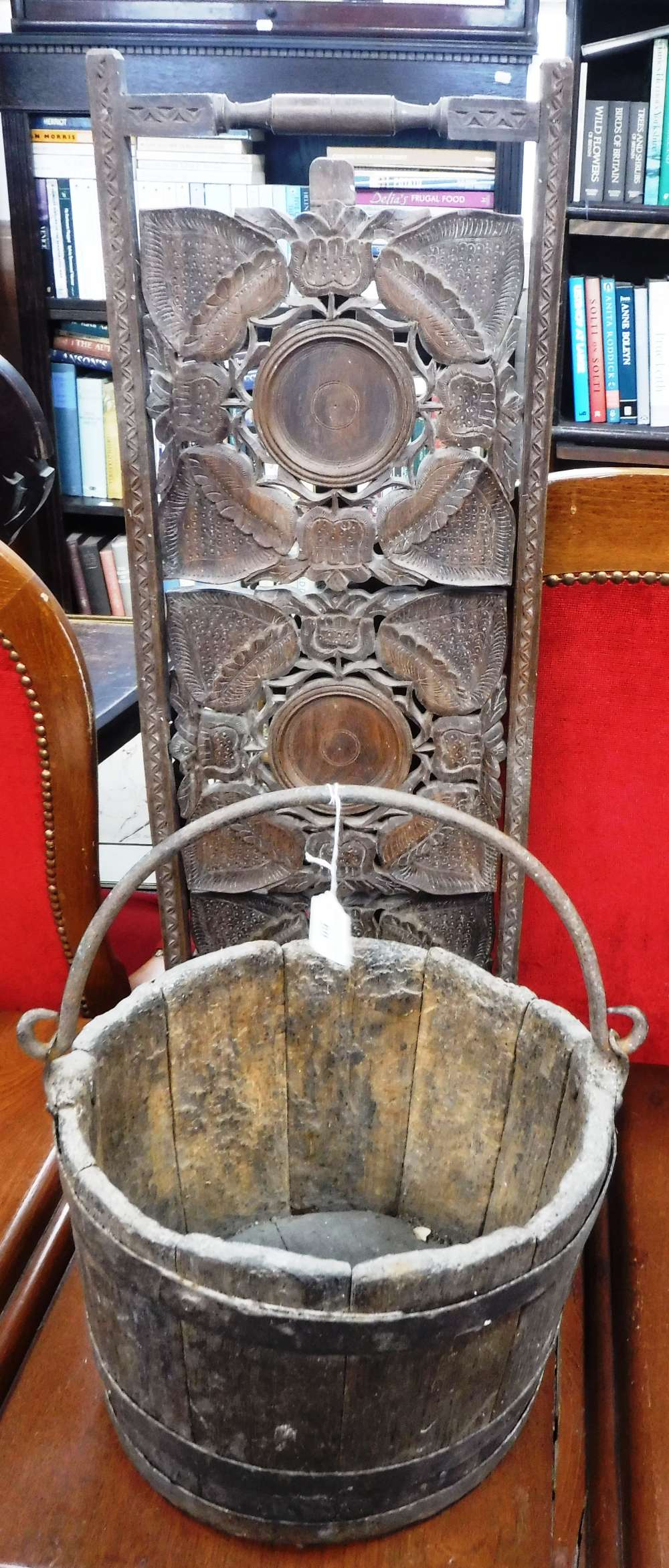 A 19TH CENTURY METAL BOUND BUCKET with iron swing handle and a folding cake stand with carved