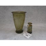 A ROMAN STYLE GREEN GLASS BEAKER and similar vessel